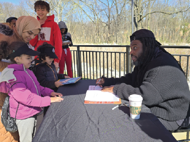 jason reynolds signing books for students